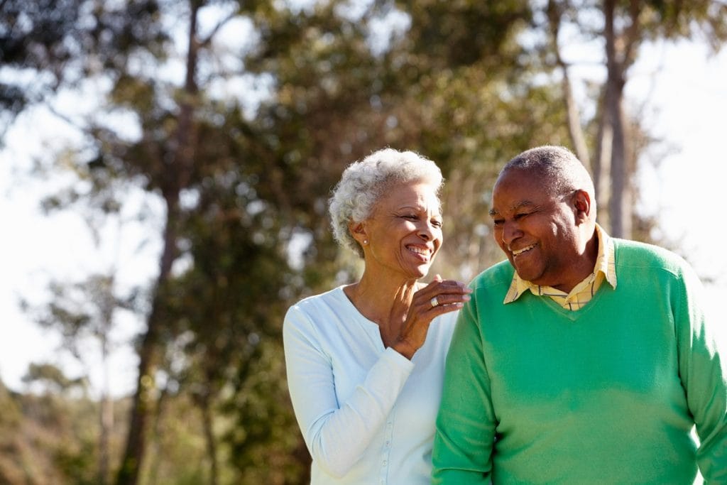 A senior couple enjoying a walk together.