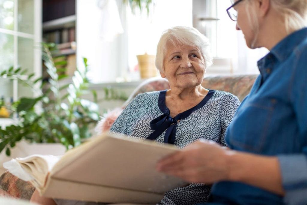 adult child with parents at the Valeo Memory Care Neighborhood HearthStone at Wildwood