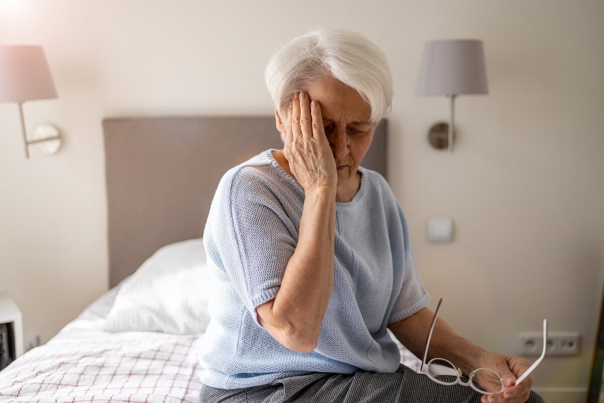 Senior Woman with Dementia in Her Bedroom