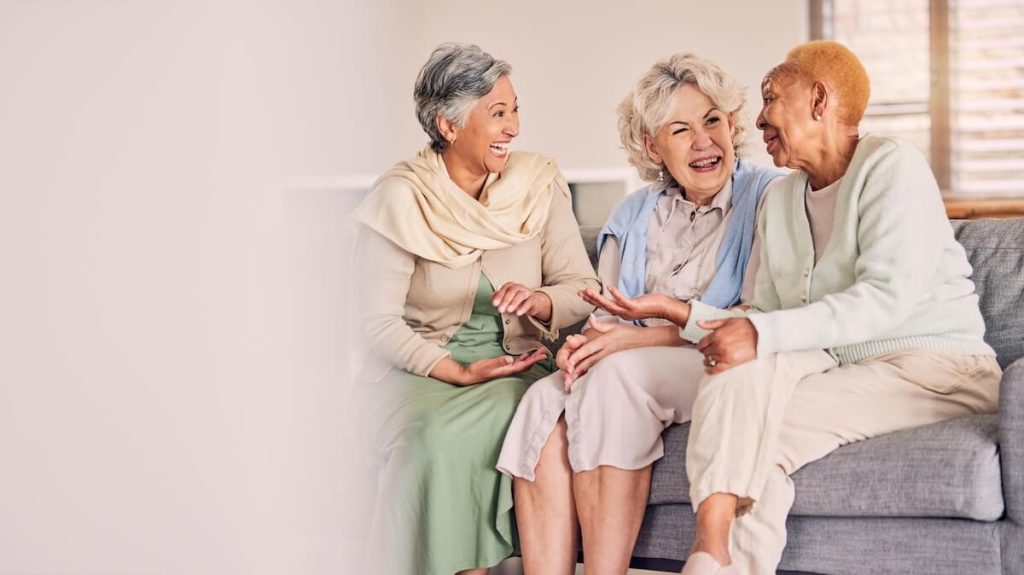 Happy older women talking together