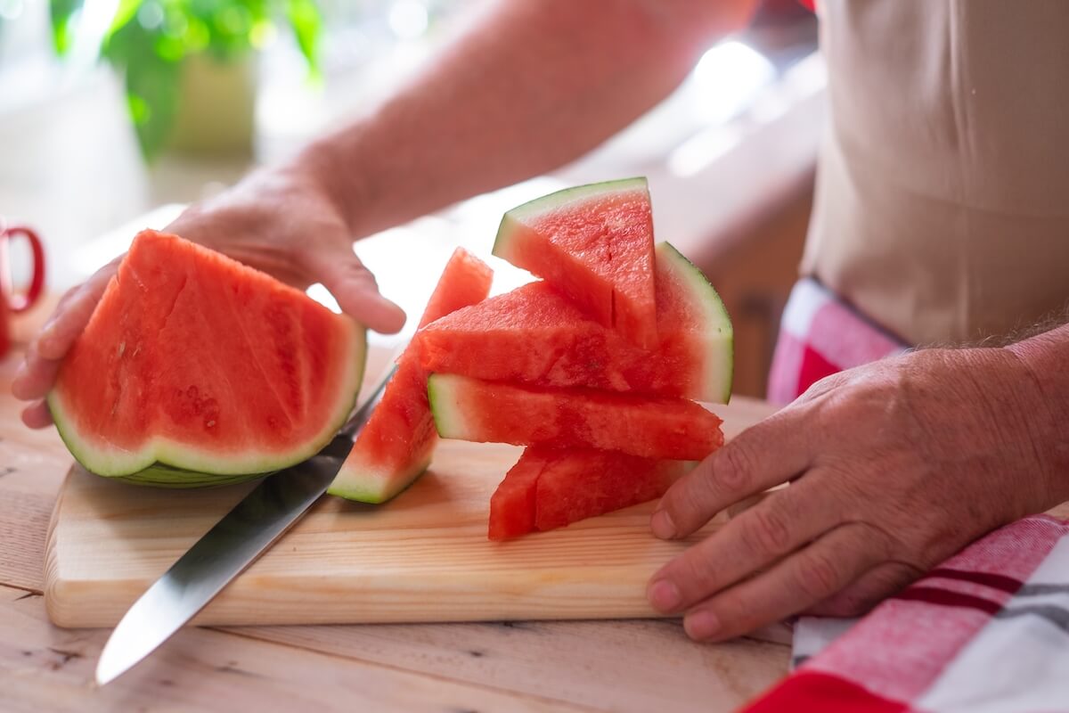 Sliced watermelon over a wooden chopping board