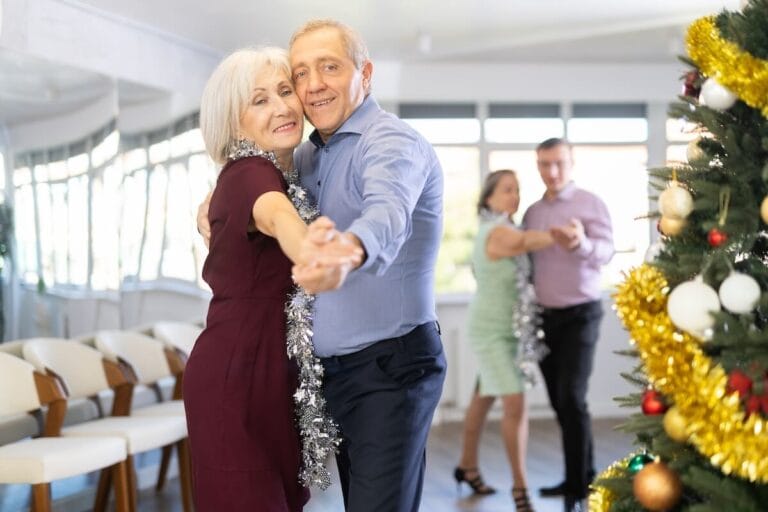 Couple of older adults taking a dancing class.